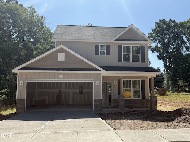 61 Fetterbush Way, Clayton, NC 27520 - craftsman house featuring brick siding, a porch, driveway, and an attached garage