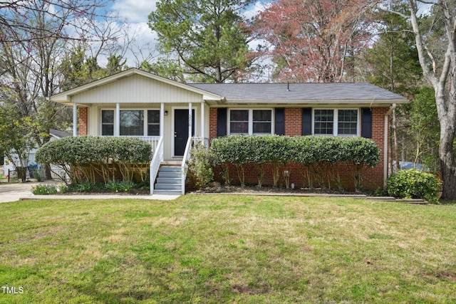 single story home with a front yard and brick siding