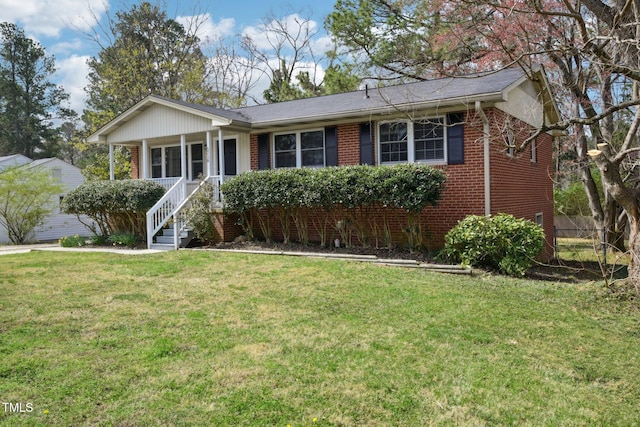 ranch-style house featuring covered porch, a front lawn, and brick siding