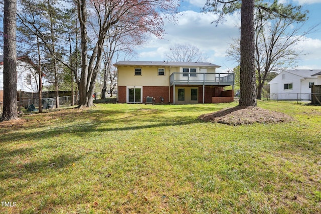 back of property featuring a wooden deck, central air condition unit, a yard, fence, and brick siding