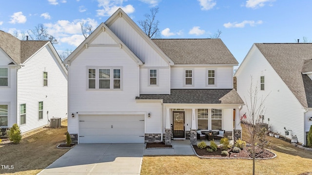 1408 Weavers Trace Dr, Zebulon, NC 27597 - view of front of property featuring a shingled roof, central AC, board and batten siding, and concrete driveway