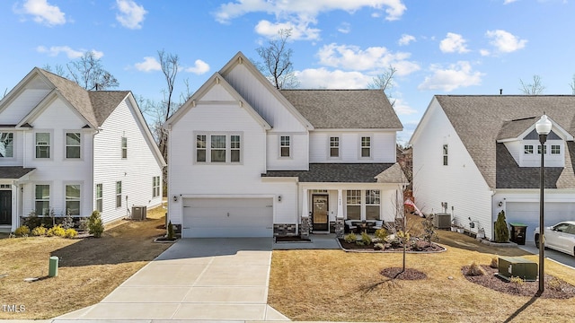 1408 Weavers Trace Dr, Zebulon, NC 27597 - modern inspired farmhouse featuring an attached garage, central AC unit, concrete driveway, and roof with shingles