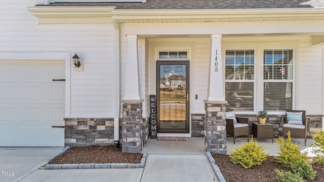 1408 Weavers Trace Dr, Zebulon, NC 27597 - doorway to property featuring covered porch, stone siding, a garage, and a shingled roof
