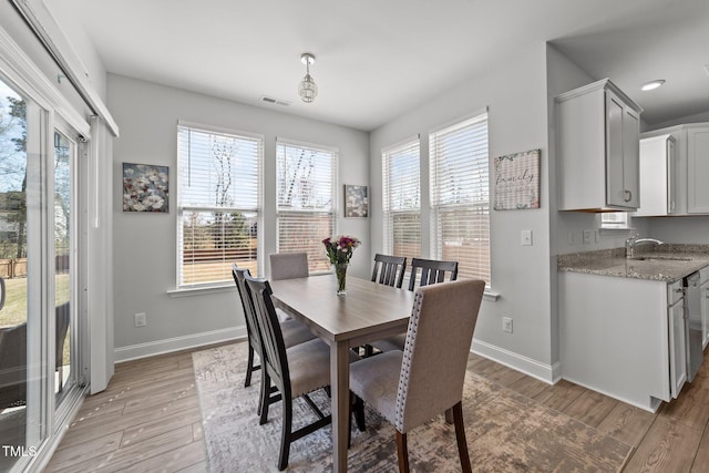 1408 Weavers Trace Dr, Zebulon, NC 27597 - dining room featuring baseboards, light wood finished floors, and visible vents