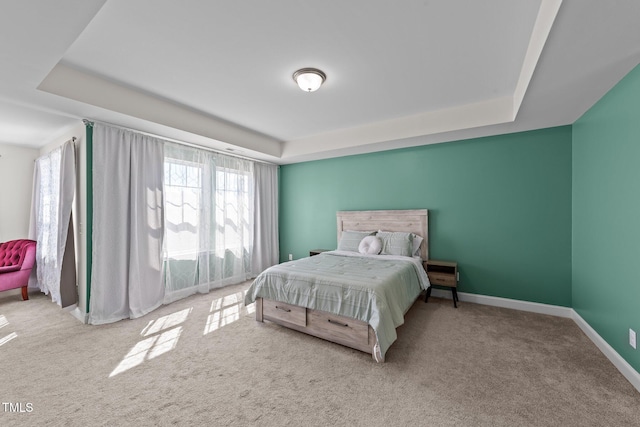1408 Weavers Trace Dr, Zebulon, NC 27597 - bedroom with baseboards, a tray ceiling, and multiple windows