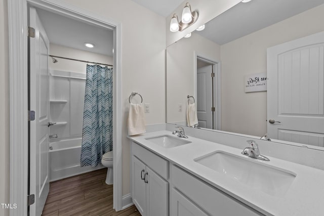 1408 Weavers Trace Dr, Zebulon, NC 27597 - bathroom with double vanity, a sink, toilet, and wood finished floors