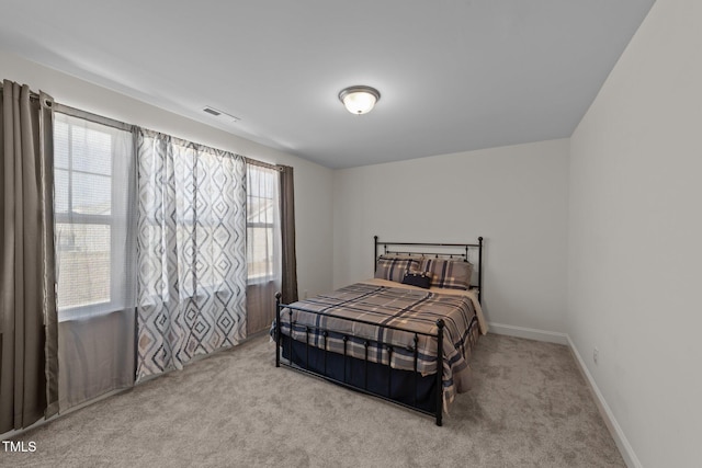 1408 Weavers Trace Dr, Zebulon, NC 27597 - bedroom with baseboards, carpet floors, and visible vents
