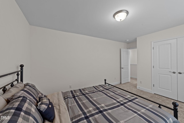 1408 Weavers Trace Dr, Zebulon, NC 27597 - unfurnished bedroom with light colored carpet, a closet, and baseboards