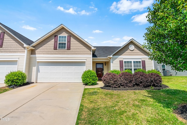 1004 Gold Cir, Mebane, NC 27302 - multi unit property featuring a garage, driveway, and a front yard