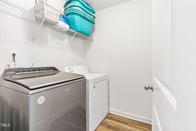 1004 Gold Cir, Mebane, NC 27302 - clothes washing area with baseboards, laundry area, light wood-type flooring, and washer and dryer