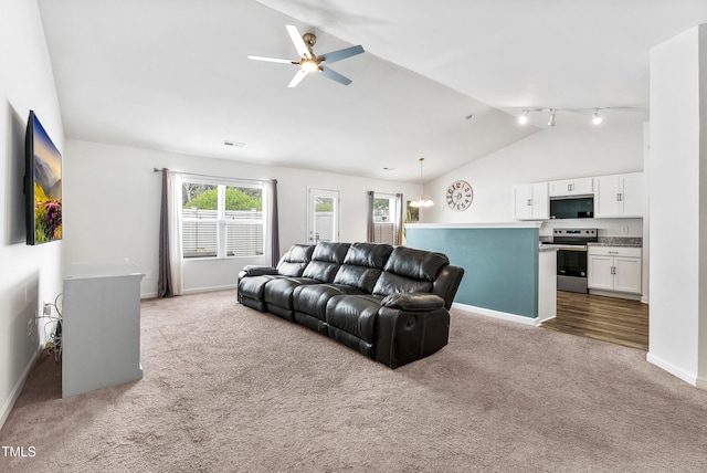 1004 Gold Cir, Mebane, NC 27302 - living area with carpet floors, visible vents, baseboards, a ceiling fan, and vaulted ceiling