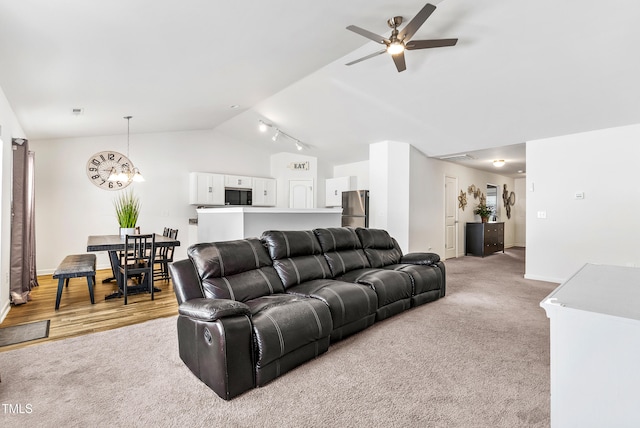 1004 Gold Cir, Mebane, NC 27302 - living area featuring ceiling fan, vaulted ceiling, light carpet, and baseboards