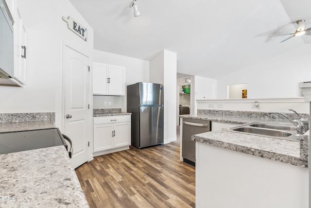 1004 Gold Cir, Mebane, NC 27302 - kitchen with a sink, lofted ceiling, white cabinets, and stainless steel appliances