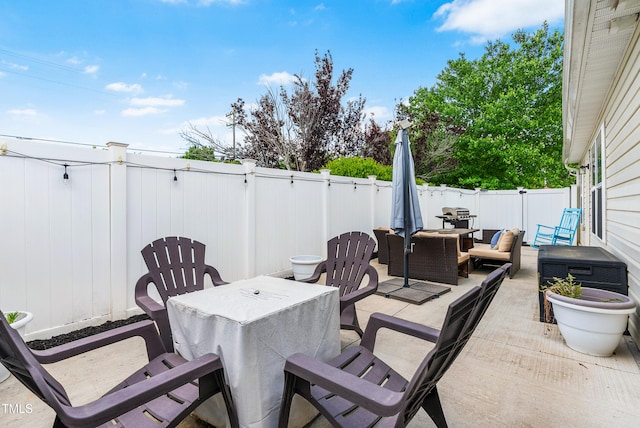1004 Gold Cir, Mebane, NC 27302 - view of patio with a fenced backyard, outdoor dining space, and outdoor lounge area