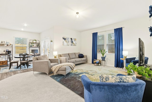 living room featuring baseboards and recessed lighting