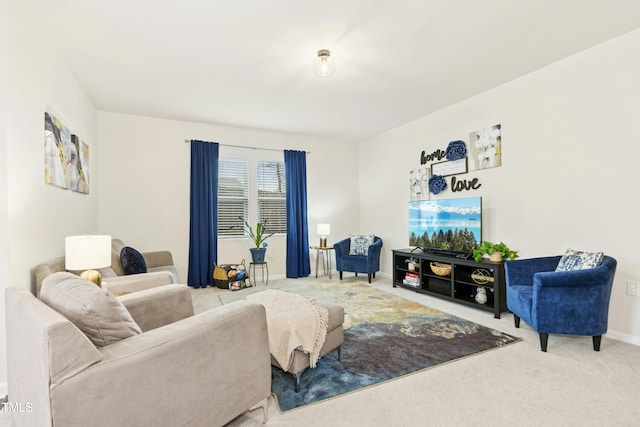 carpeted living area featuring baseboards