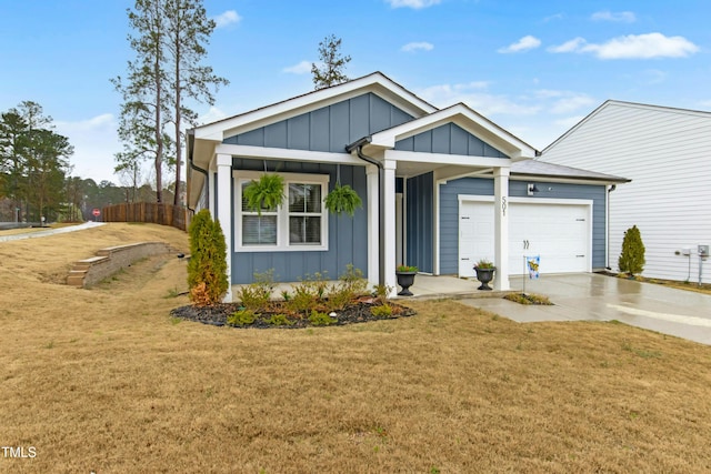 view of front of home featuring an attached garage, a front lawn, board and batten siding, and concrete driveway