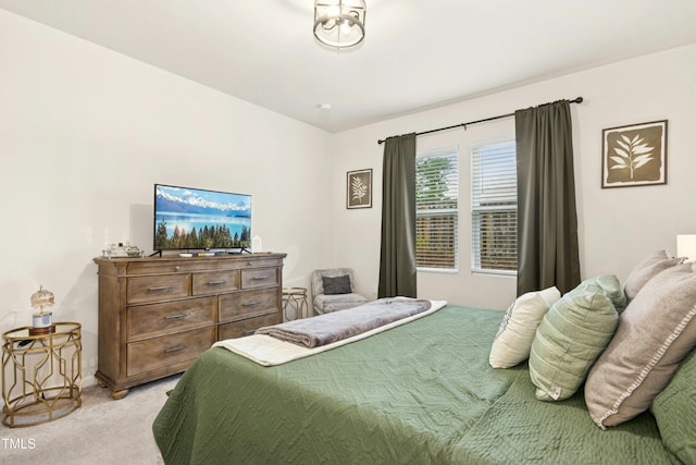 bedroom featuring light carpet