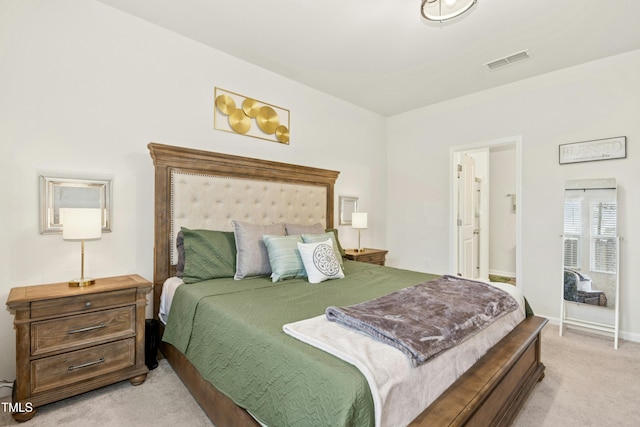 bedroom with visible vents and light carpet