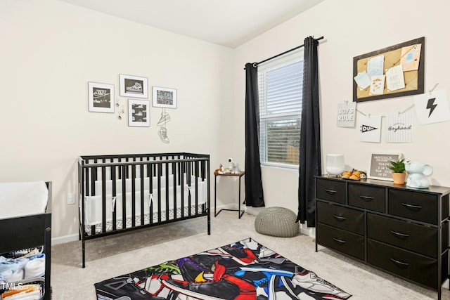 bedroom featuring baseboards and carpet