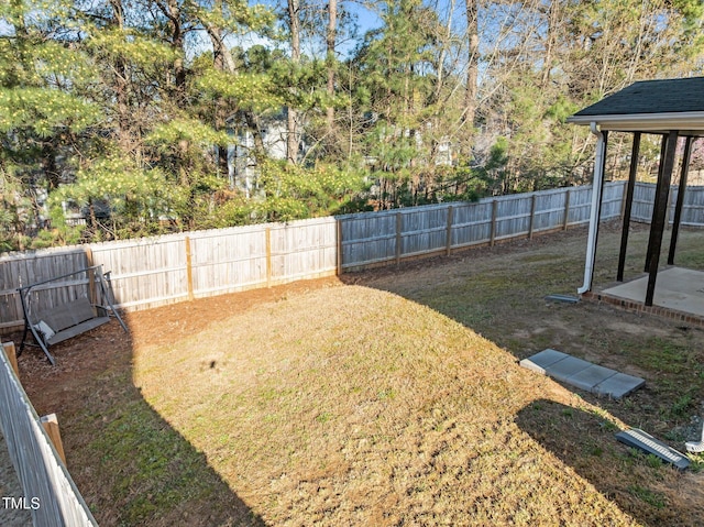 view of yard with a fenced backyard