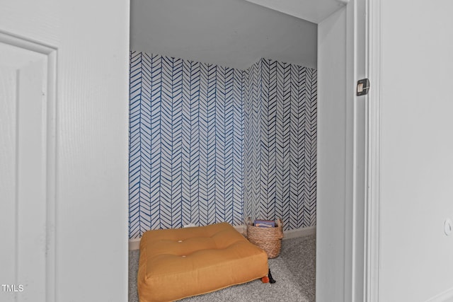 bathroom with wallpapered walls