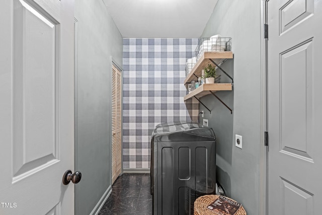 laundry area with wallpapered walls, laundry area, and washer / dryer