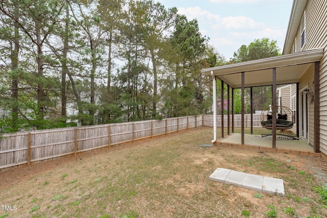 view of yard with a fenced backyard and a patio area