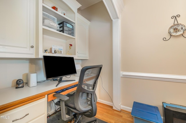608 Adler Ln, Goldsboro, NC 27530 - office featuring built in desk, baseboards, and light wood finished floors