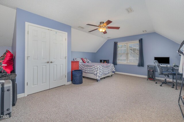 608 Adler Ln, Goldsboro, NC 27530 - bedroom with vaulted ceiling, a closet, carpet flooring, a textured ceiling, and visible vents