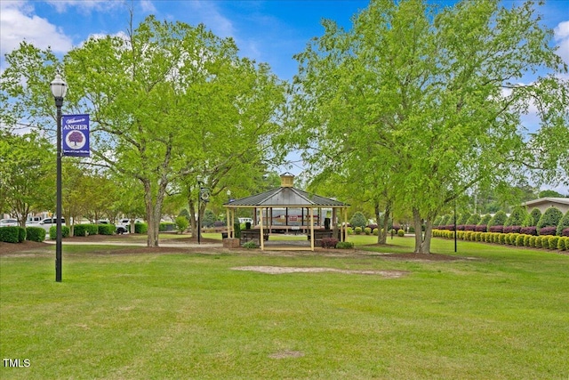 view of property's community featuring a lawn and a gazebo
