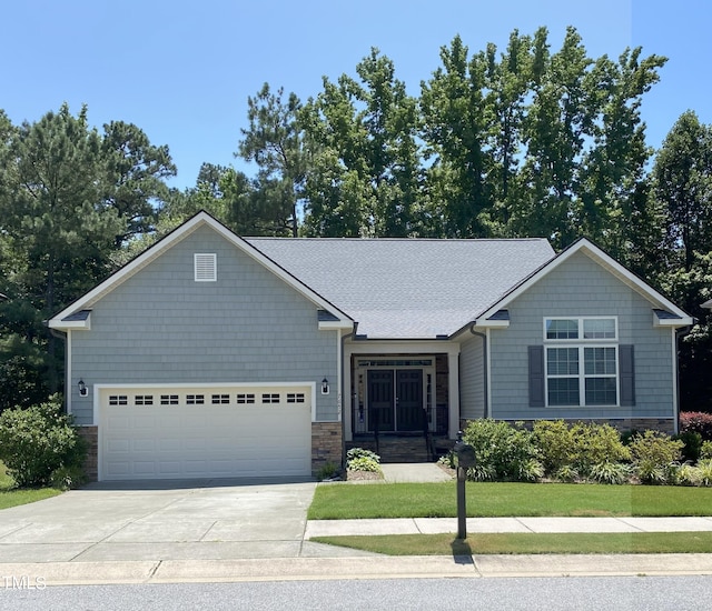 7652 Channery Way, Raleigh, NC 27616 - view of front of house with driveway and an attached garage