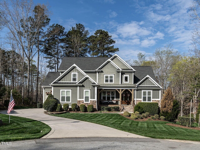 107 Bella Casa Way, Clayton, NC 27527 - craftsman inspired home featuring driveway, a front yard, stone siding, board and batten siding, and a porch