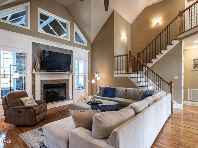 107 Bella Casa Way, Clayton, NC 27527 - living area featuring visible vents, plenty of natural light, stairway, and wood finished floors