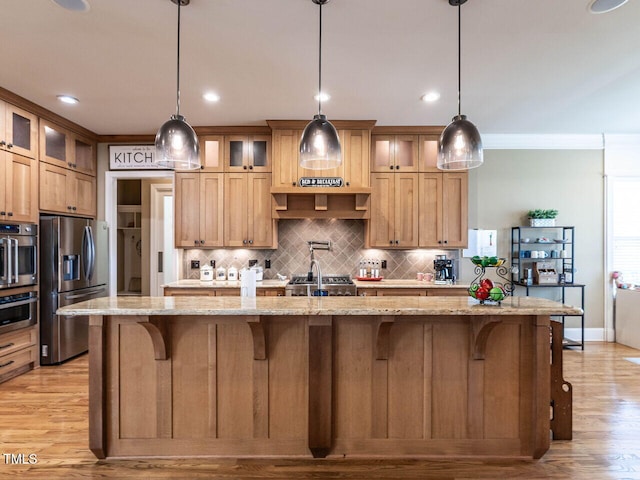 107 Bella Casa Way, Clayton, NC 27527 - kitchen with a large island, stainless steel appliances, backsplash, and a breakfast bar area