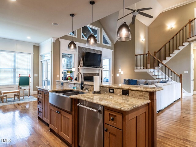 107 Bella Casa Way, Clayton, NC 27527 - kitchen featuring ceiling fan, a sink, brown cabinetry, and open floor plan