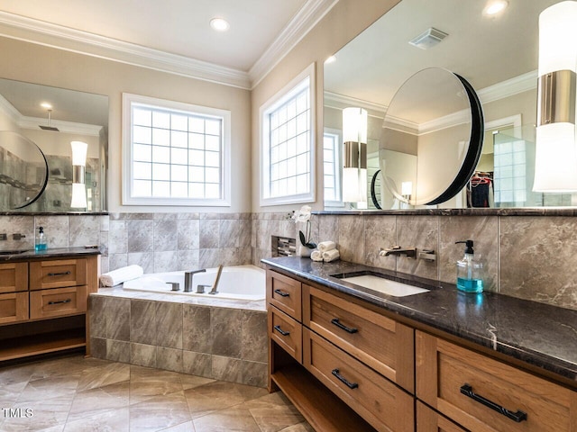107 Bella Casa Way, Clayton, NC 27527 - bathroom with crown molding, a sink, two vanities, a garden tub, and visible vents