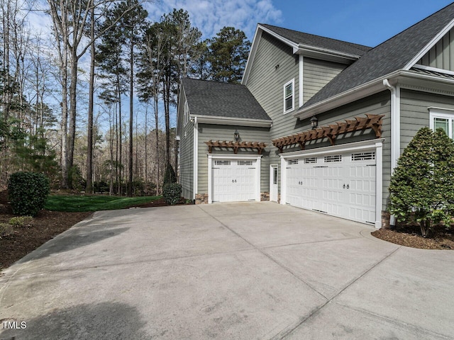 107 Bella Casa Way, Clayton, NC 27527 - view of home's exterior featuring concrete driveway, roof with shingles, and an attached garage