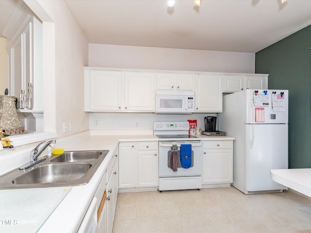 kitchen featuring white appliances, a sink, white cabinetry, and light countertops
