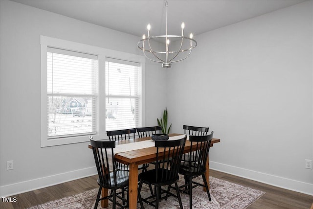 305 Wash Hollow Dr, Wendell, NC 27591 - dining space featuring baseboards, a notable chandelier, and dark wood-type flooring