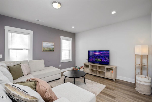 305 Wash Hollow Dr, Wendell, NC 27591 - living area featuring baseboards, visible vents, recessed lighting, and light wood-type flooring