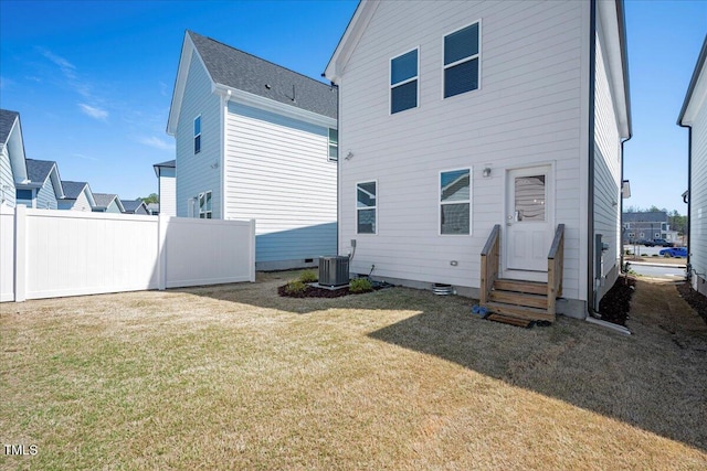 305 Wash Hollow Dr, Wendell, NC 27591 - back of house with a yard, fence, central AC unit, and entry steps