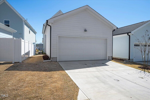 305 Wash Hollow Dr, Wendell, NC 27591 - garage featuring concrete driveway and fence