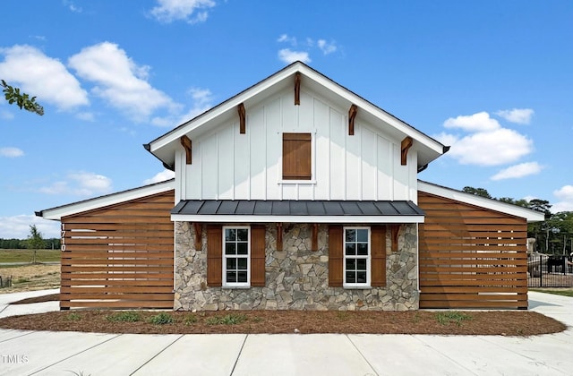 305 Wash Hollow Dr, Wendell, NC 27591 - view of side of property with stone siding and board and batten siding