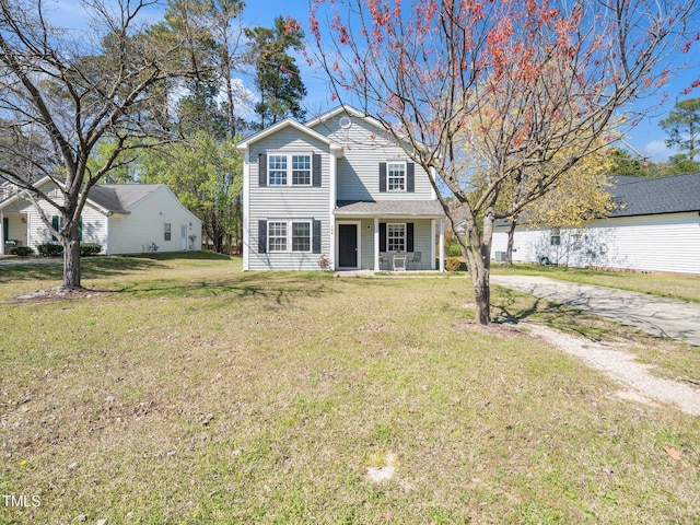106 Mingocrest Dr, Knightdale, NC 27545 - view of front facade featuring a gambrel roof, driveway, and a front yard