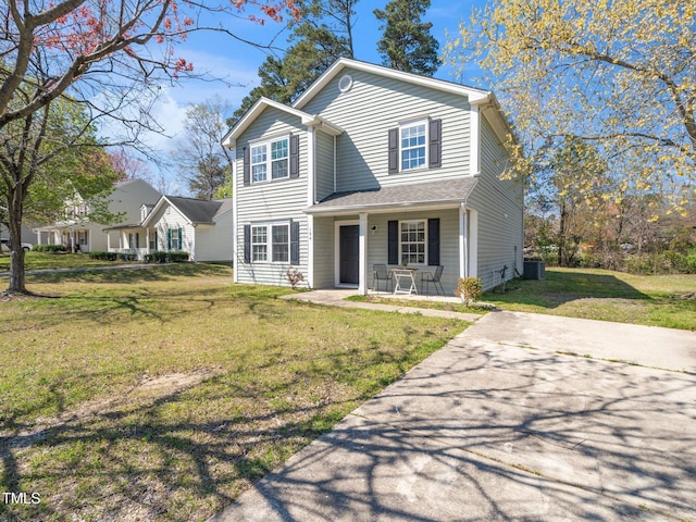 106 Mingocrest Dr, Knightdale, NC 27545 - traditional home with covered porch, a front yard, and central air condition unit