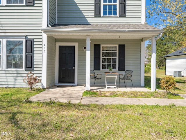 106 Mingocrest Dr, Knightdale, NC 27545 - doorway to property featuring a porch, central AC unit, roof with shingles, and a lawn