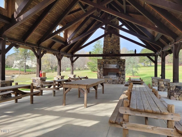 view of property's community with a lawn, a patio, and a gazebo