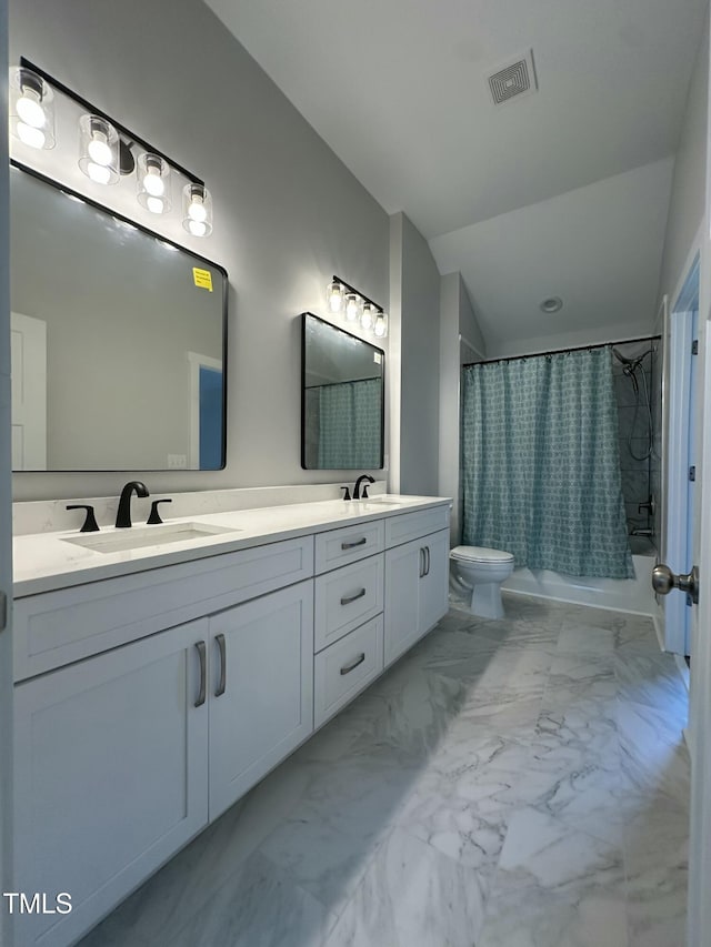 full bath with toilet, marble finish floor, a sink, visible vents, and shower / bath combo