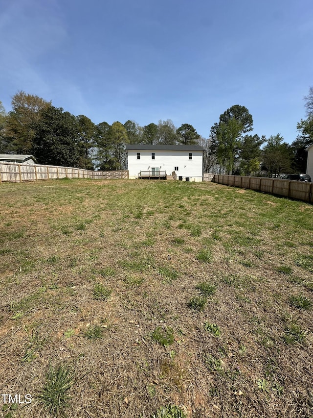 view of yard featuring a fenced backyard